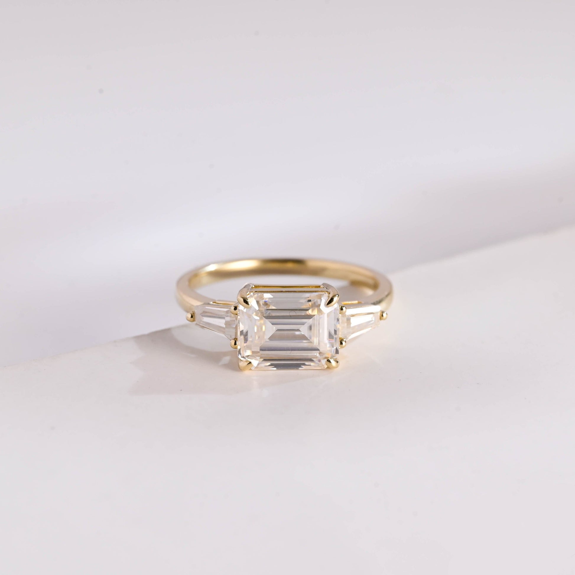 SquareJewelry emerald cut moissanite engagement ring East West Side Tapered Baguette Emerald Cut Moissanite Engagement Ring